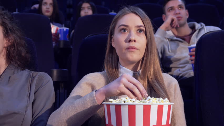 Girl eating popcorn