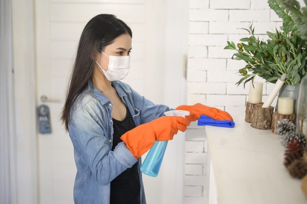 woman using gloves and sanitizer